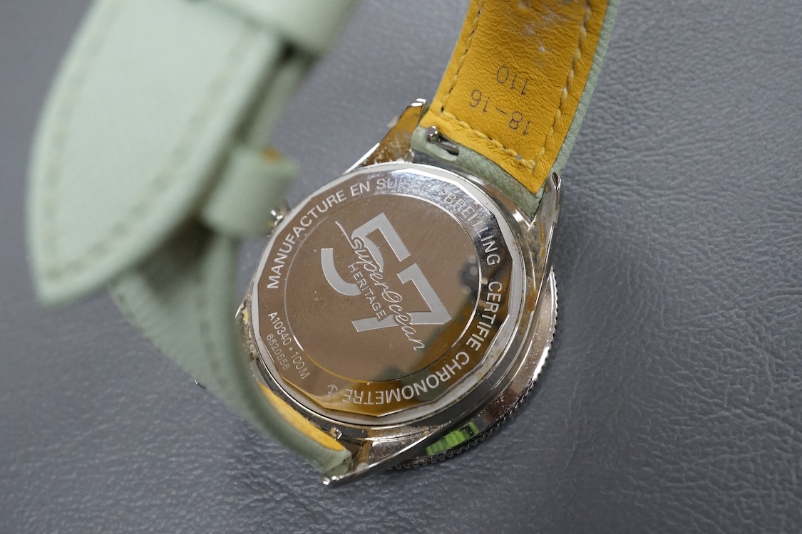 A lady's recent stainless steel Breitling SuperOcean Heritage Automatic cal. 38 57 chronometer wrist watch, with light green dial and baton numerals, case diameter 37mm, on a light green leather strap with Breitling buck